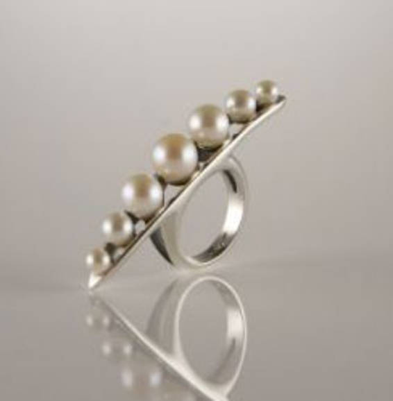 A pleasure ring made from seven beads.