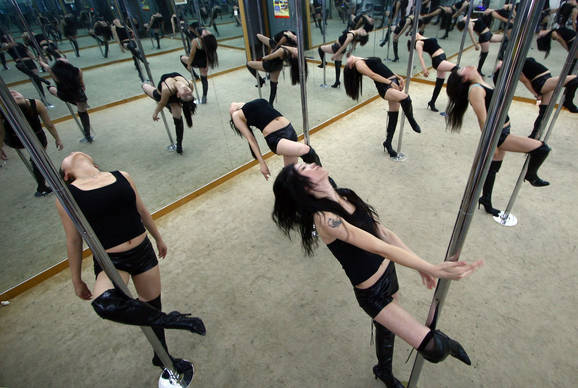Pole dancing has everything that a good exercise needs - women get a thorough workout, strengthen muscles, and feel free and sexy.